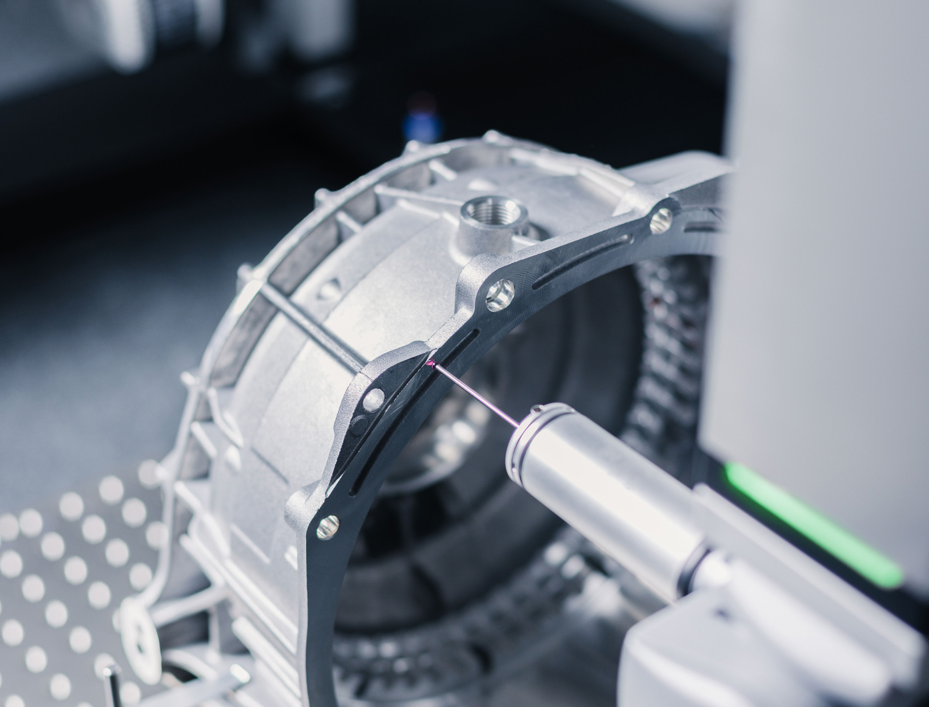 A silver part of a machine which is being constructed